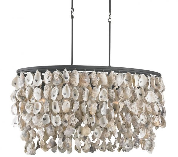 Dripping in oyster shells the Stillwater chandelier by Currey and Company is perfect for beach living.