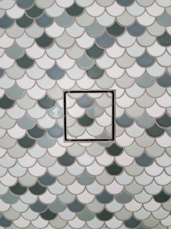 Scallop tile, mermaid scale tile in a coastal bathroom remodel