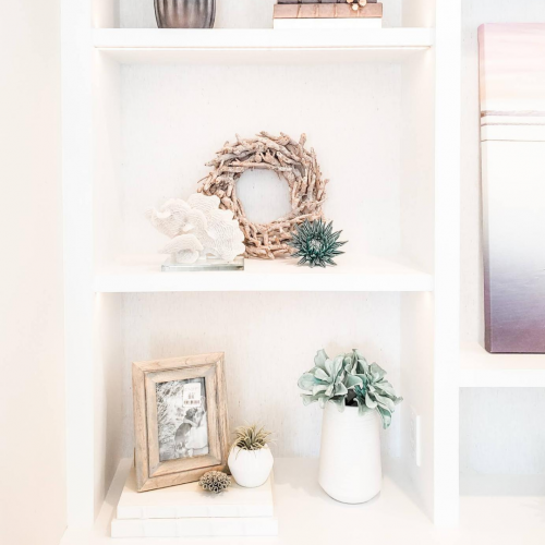 Use groups of three for bookcase styling